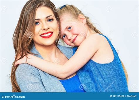 hugging mother and daughter|More.